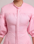 pink button-down shirt dress with voluminous sleeves and fitted waist