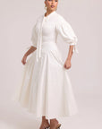 White cotton dress with lace-up back and curved waist cut-out