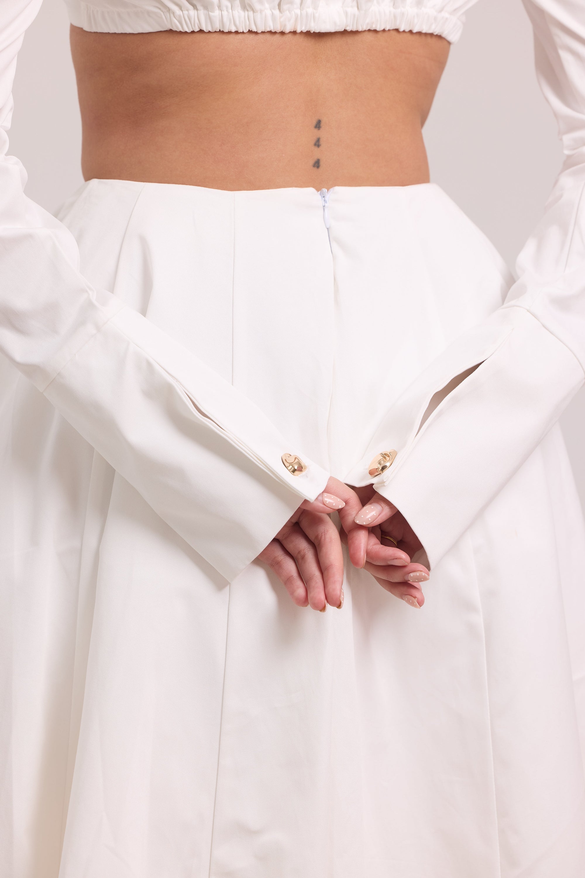 Pleated long-sleeve crop top with defined under-bust seams