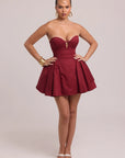 Voluminous mini dress with defined waist