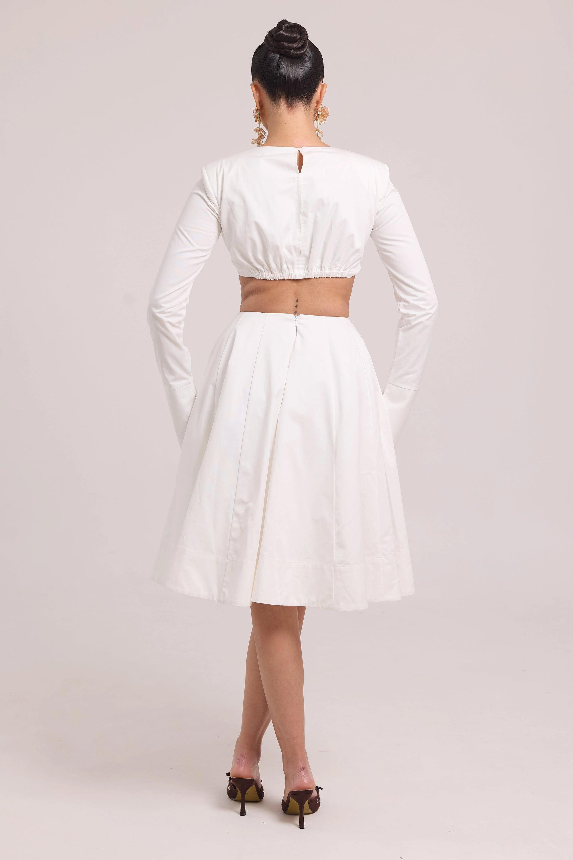 Long-sleeve crop top with contoured seams and matching full skirt