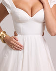 White dress with refined structure and flow