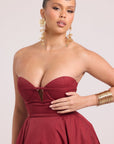 Close up shot of strapless burgundy dress 
