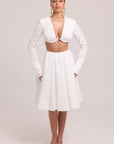 Two-piece set with pleated long-sleeve crop top and full skirt