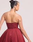 Back view of strapless burgundy midi dress