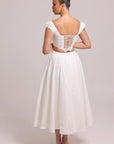 White cotton dress with lace-up back and curved waist cut-out